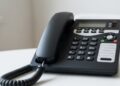 Why is a landline phone necessary at home?